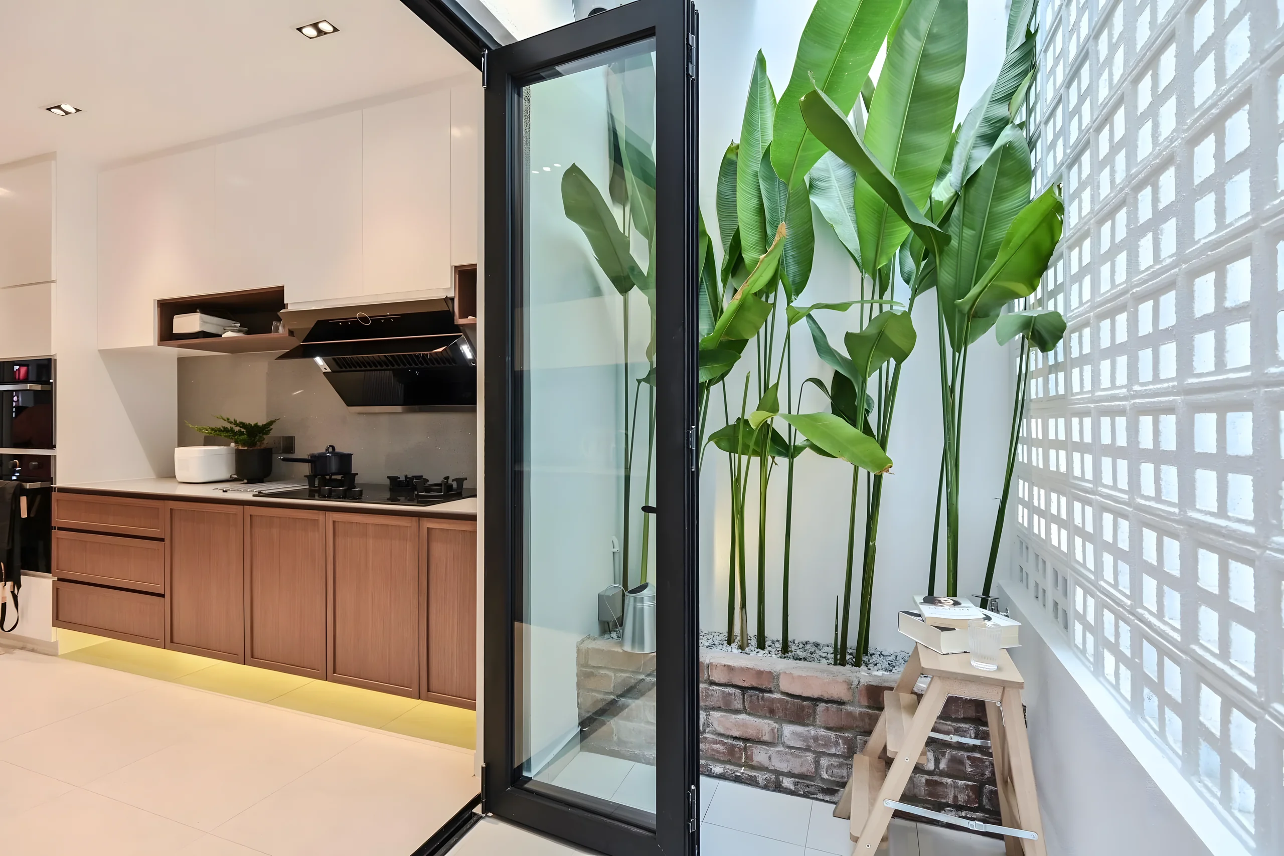 Kitchen opening to a planted courtyard